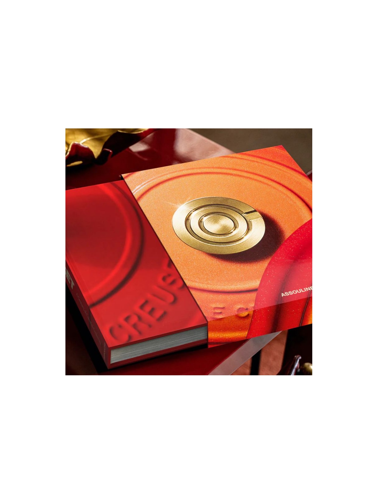 LIVRO LE CREUSET: A CENTURY OF COLORFUL COOKWARE_LARANJA Assouline